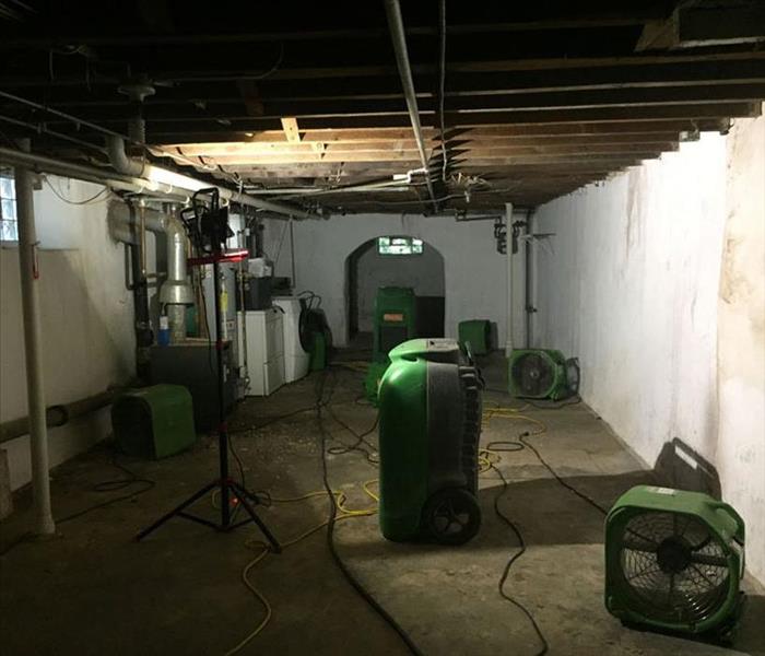 equipment positioned in a rectangular basement drying it out