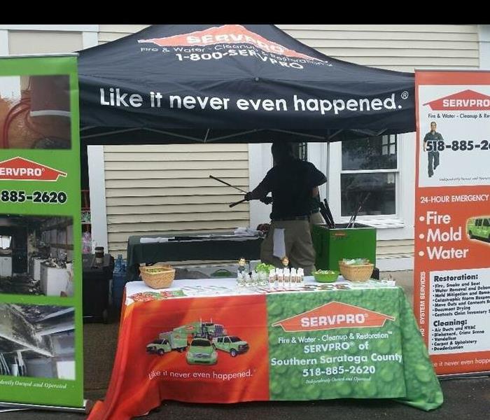 SERVPRO tent and table with large signs on each side