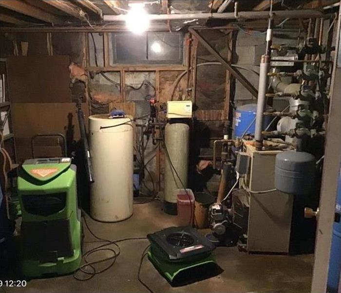 A basement covered in water after a water heater burst