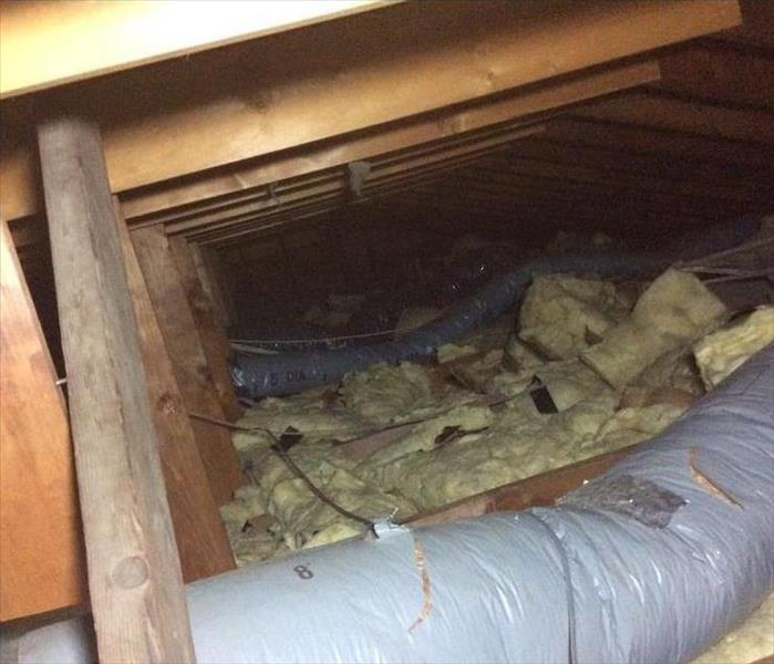 attic damage from a storm